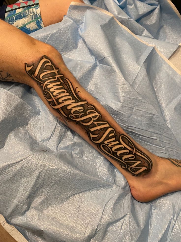 a man with a tattoo on his leg