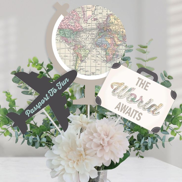 a vase filled with flowers next to an airplane and the words around the world on it