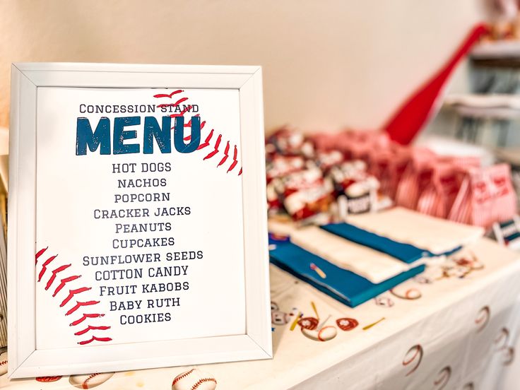 a baseball themed menu is displayed on a table with other items in the back ground