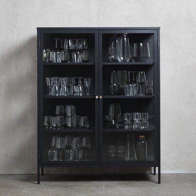 a black cabinet filled with lots of glass cups and glasses on top of each shelf