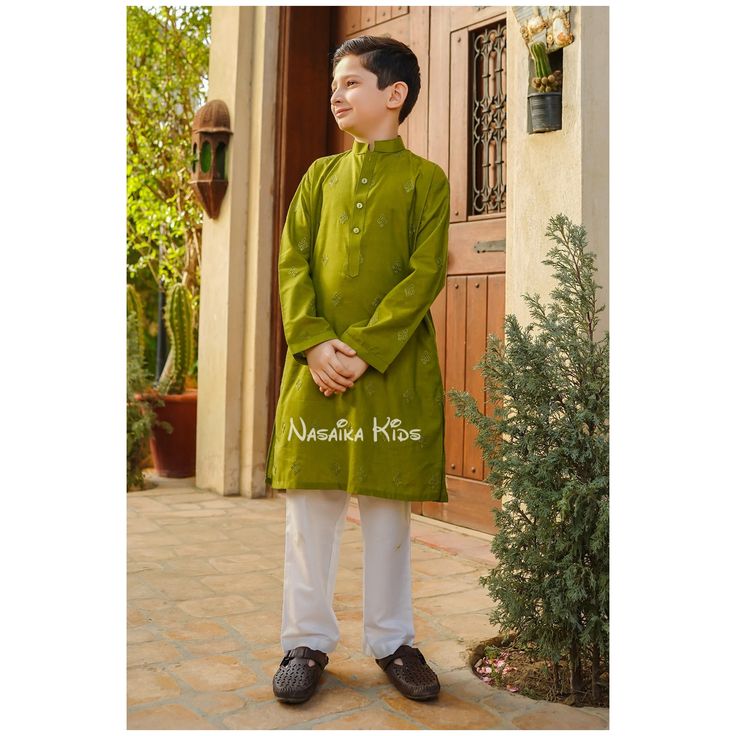 Ready to ship and wear Pakistani boys 2pc shalwar kameez A green cotton chambray kurta with a subtle green embroidered motif gives this style a formal look and is accompanied with white cotton trousers for your handsome lad this festive season. Item details: Top: Green Chambray Cotton Kurta with Embroidery Trouser: White Cotton Trouser Note: Actual product color of the outfit may vary slightly from the image being displayed on your device. More pictures and videos coming soon *Feel free to send Green Kurta With Naqshi For Festivals, Green Sherwani With Naqshi For Eid, Green Naqshi Sherwani For Eid, Green Naqshi Churidar For Eid, Green Naqshi Sherwani For Diwali, Green Long Sleeve Cotton Churidar, Green Dabka Detailed Long Sleeve Sherwani, Green Long Sleeve Sherwani With Dabka, Green Long Sleeve Dabka Sherwani