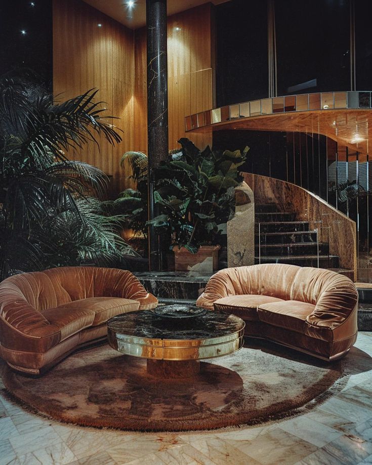 a living room filled with furniture next to a spiral staircase