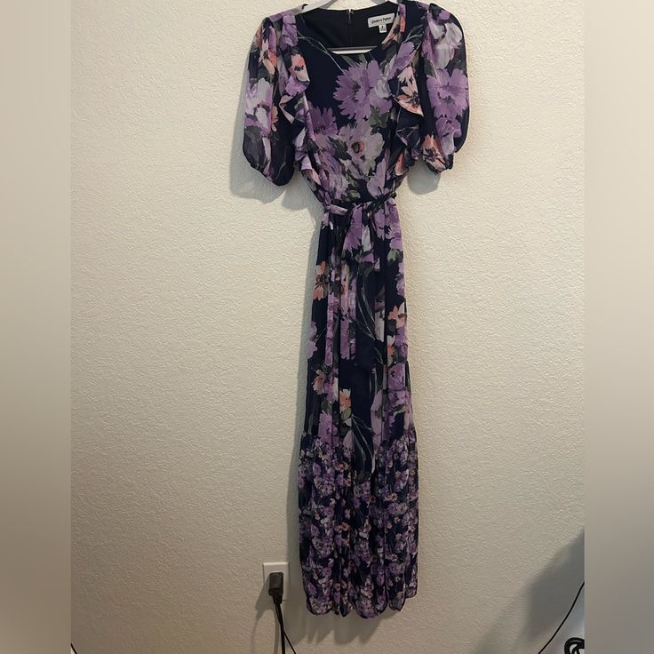 Gorgeous Light And Flowy Floral Maxi Dress By Shelby And Palmer. Never Worn. Size 8. Tie Waist, Back Zipper. Bundle From My Closet And Save On Shipping!! Purple Floral Dress For Party, Purple Floral Print Midi Dress For Beach, Lavender Floral Print Short Sleeve Dress, Flowy Lavender Maxi Dress With Floral Print, Casual Purple Floral Print Maxi Dress, Purple Short Sleeve Maxi Dress, Purple Floral Print Midi Dress For Vacation, Purple Floral Midi Dress For Vacation, Vacation Purple Floral Print Midi Dress