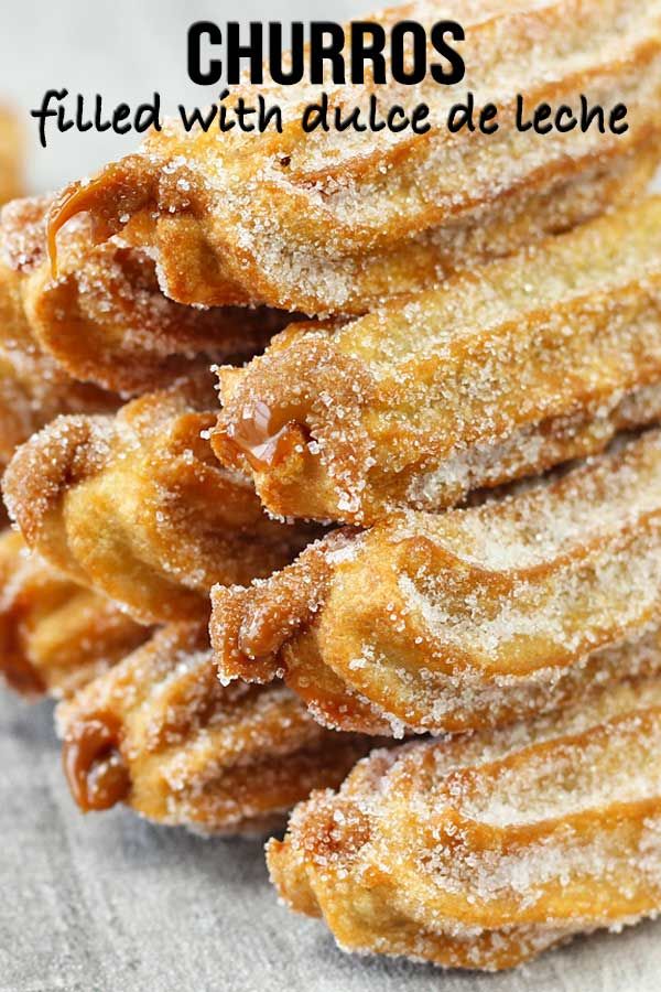 a stack of churros sitting on top of a table next to each other