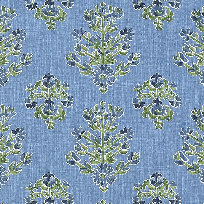 a blue and green floral pattern on fabric