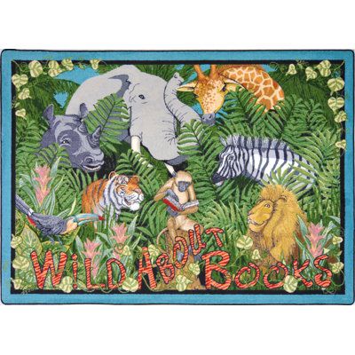 an animal themed rug with the words wild books written in red and blue on it