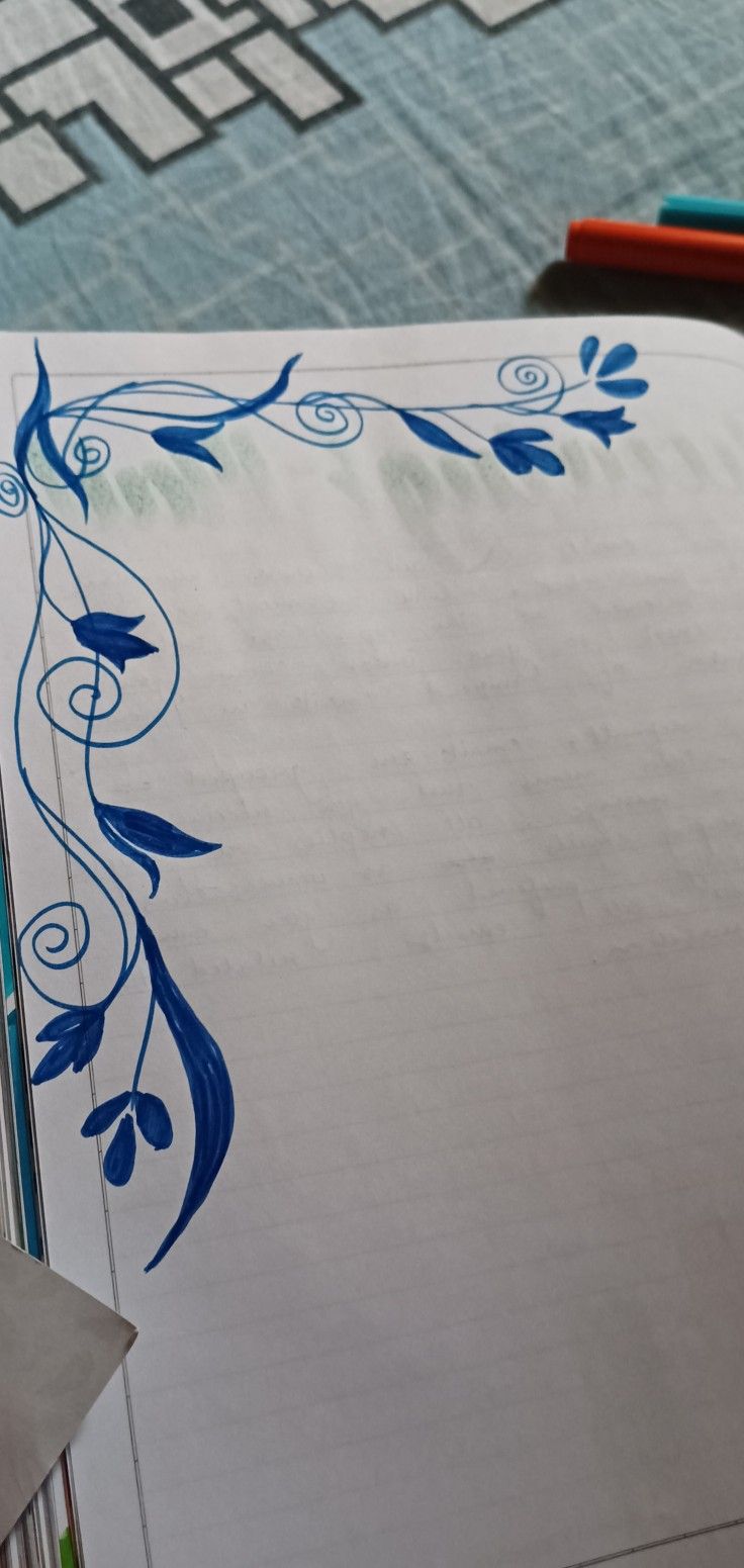 a piece of paper with blue designs on it