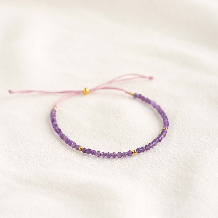 A dainty amethyst beaded bracelet with gold vermeil bead accents. This gorgeous bracelet is a perfect way to add a pop of color to your summer wardrobe.

Amethyst meaning: Amethyst stones inspire peace, intuition and clarity of thought.


Amethyst gemstones measure at 2.5mm.

Bracelet has an adjustable cord and can be worn at lengths between 5.5” to 9.5”. Purple Bohemian Bracelet For Everyday Wear, Purple Bohemian Bracelet For Everyday, Elegant Purple Beaded Bracelets With Tiny Beads, Lavender Bracelets With Tiny Beads For Gift, Dainty Purple Beaded Bracelets With Round Beads, Dainty Purple Beaded Bracelet With Round Beads, Dainty Purple Beaded Bracelet, Adjustable Purple Bracelet With Tiny Beads, Adjustable Purple Bracelets With Tiny Beads