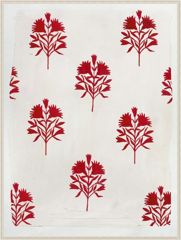 a red and white pattern on a piece of paper that has been cut into small trees