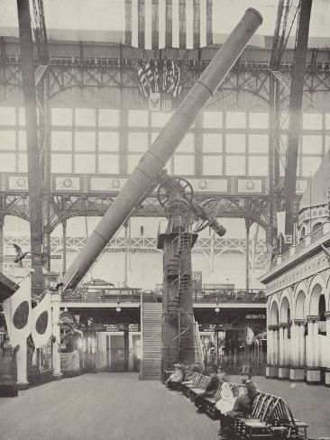 an old black and white photo of the inside of a train station with people sitting on benches