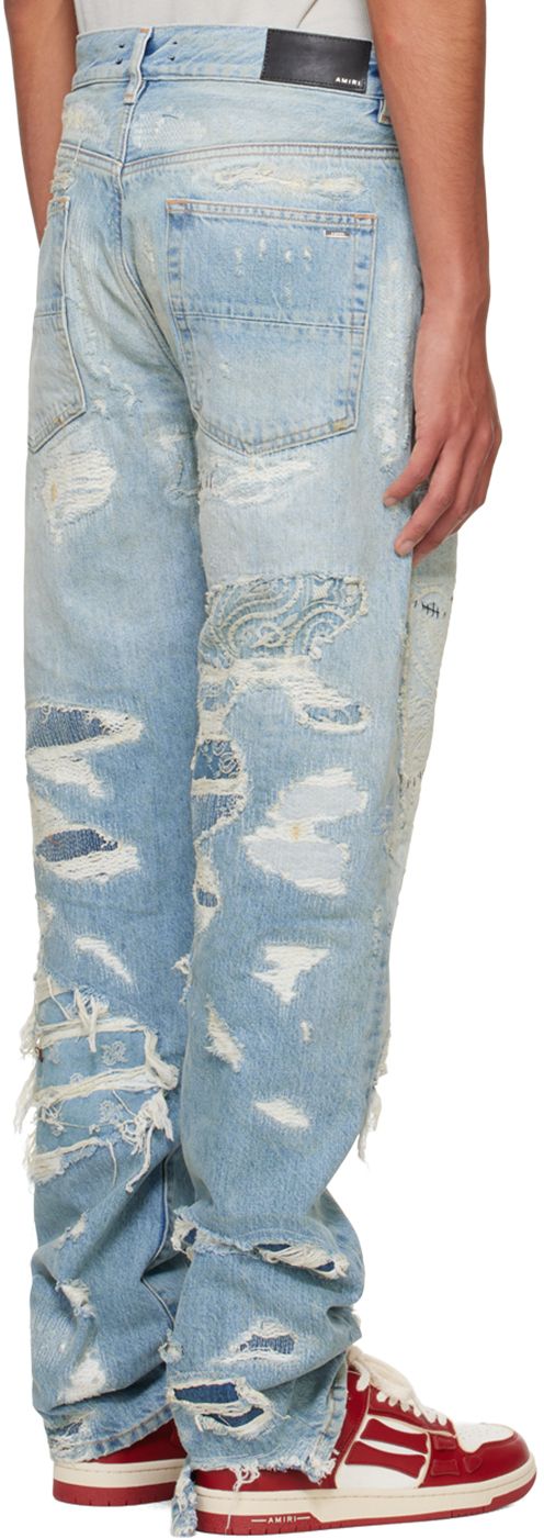 Straight-leg non-stretch denim jeans. Fading, distressing, and embroidered inset patches throughout. · Belt loops · Five-pocket styling · Button-fly · Logo patch at back waistband · Logo plaque at back pocket · Logo-engraved silver-tone hardware · Contrast stitching in tan Supplier color: Antique Indigo Ripped Jeans In Recycled Denim, Recycled Denim Straight Leg Jeans With Patches, Straight Leg Recycled Denim Jeans With Patches, Straight Leg Jeans With Patches In Recycled Denim, Blue Straight Leg Jeans With Patches, Recycled Denim Blue Jeans With Patches, Denim Blue Jeans With Patches, Medium Wash Straight Leg Jeans With Patches, Straight Leg Medium Wash Jeans With Patches