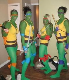 three people dressed in teenage mutant costumes