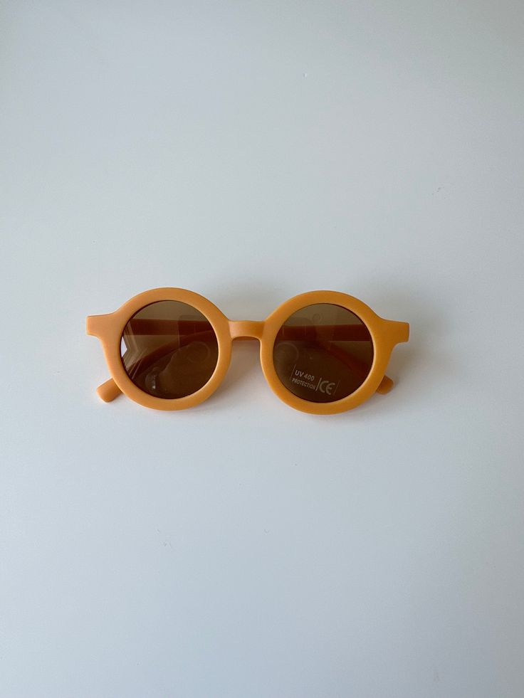 Our Retro yet minimalistic sunglasses are made entirely from recycled plastic. They are perfect for kids from 18Months - 5 years. -Unisex design -Modern colors -UV400 Protection Dimensions: 5 inch; stem length 5.5inch Playful Orange Plastic Sunglasses, Playful Yellow Sunglasses For Beach, Playful Yellow Tinted Sunglasses, Playful Yellow Sunglasses With Uv Protection, Fun Orange Plastic Sunglasses, Playful Orange Sunglasses For Beach, Retro Sunglasses, Modern Colors, Design Modern