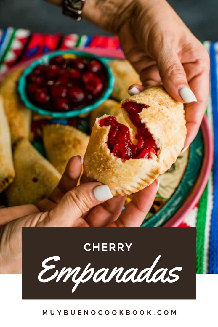 cherry empanadas on a plate with dipping sauce in the middle and text overlay reading cherry empanadas