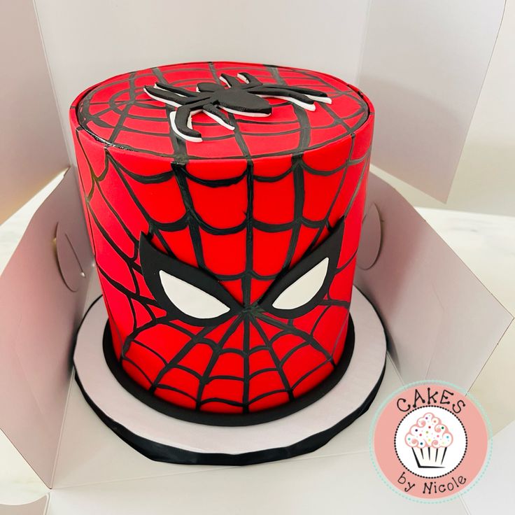 a spiderman cake in the shape of a box