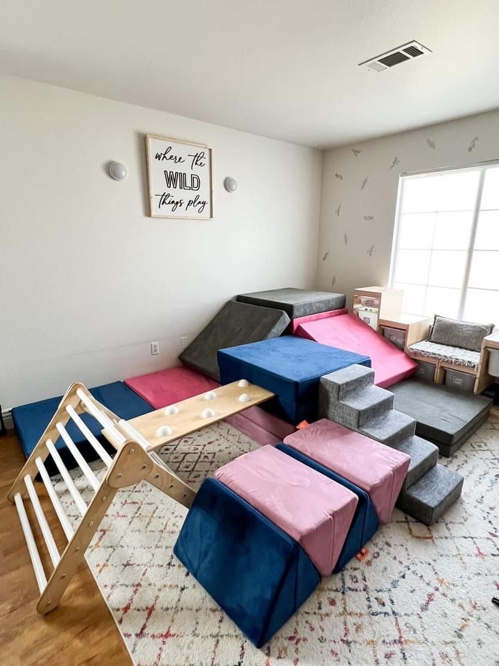 a room with several different types of furniture and rugs on the floor in it