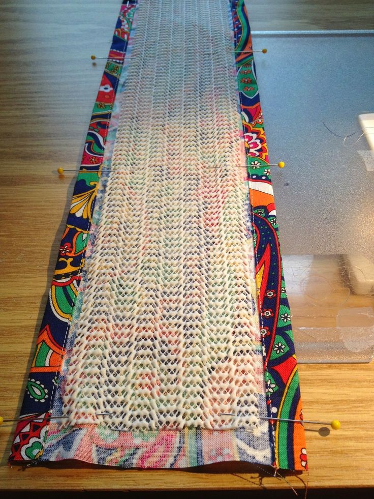 the weaving is being worked on by someone who has already finished their project, and it looks like they're making something out of fabric