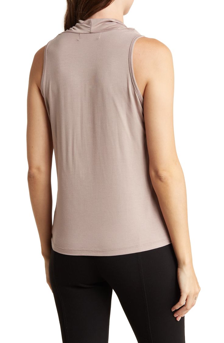 A solid hue makes this cowl-neck top easy to pair in your current wardrobe for chic, elevated style. Cowl neck Sleeveless 95% rayon, 5% spandex Machine wash, line dry Made in the USA of Imported fabric Sleeveless Tops With Built-in Bra, Flattering Sleeveless Stretch Tops, Flattering Stretch Sleeveless Top, Casual Tops With Built-in Bra And 4-way Stretch, Versatile Stretch Camisole Top, Stretch Versatile Camisole, Versatile Fitted Modal Top, Versatile Fitted Tank Top, Flattering Sleeveless Tops