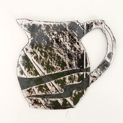 an abstract piece of art that looks like a pitcher