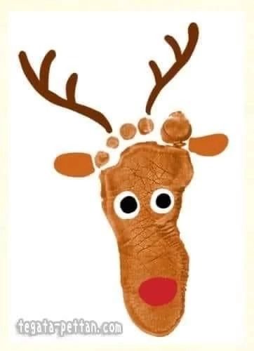 a handprinted reindeer with antlers on it's head