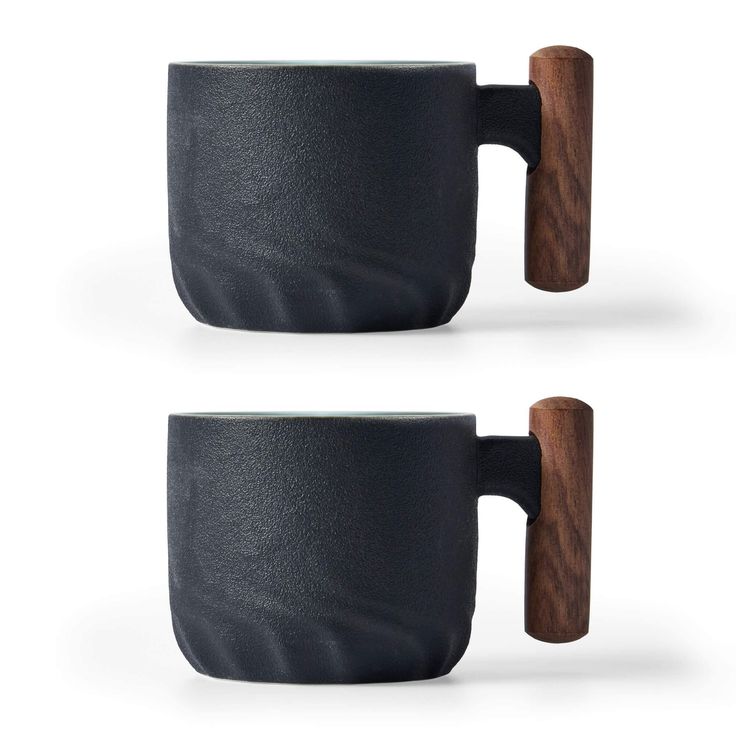 two coffee mugs with wooden handles are shown in black and grey colors, one is made out of wood