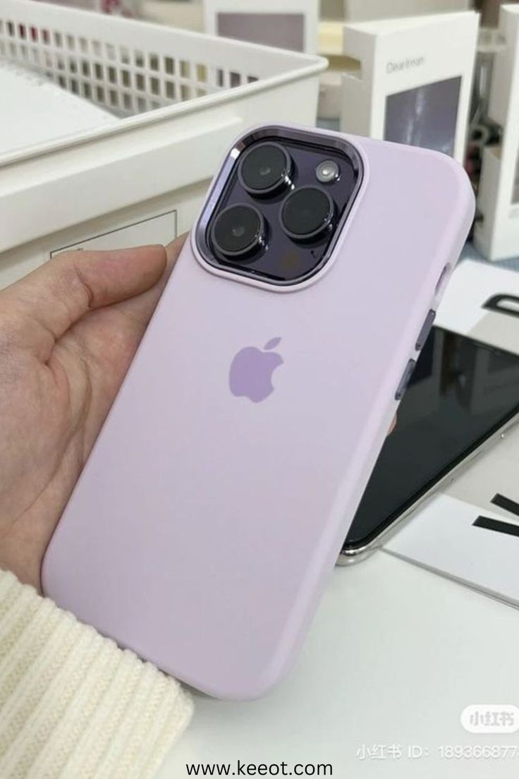 a person holding an apple phone in their hand with the case on it's side