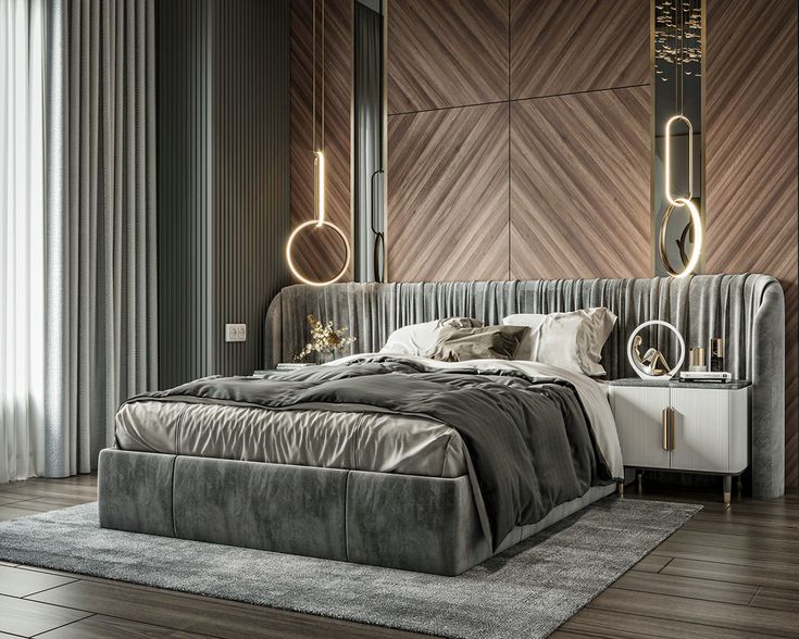 a bedroom with a large bed and two mirrors on the wall