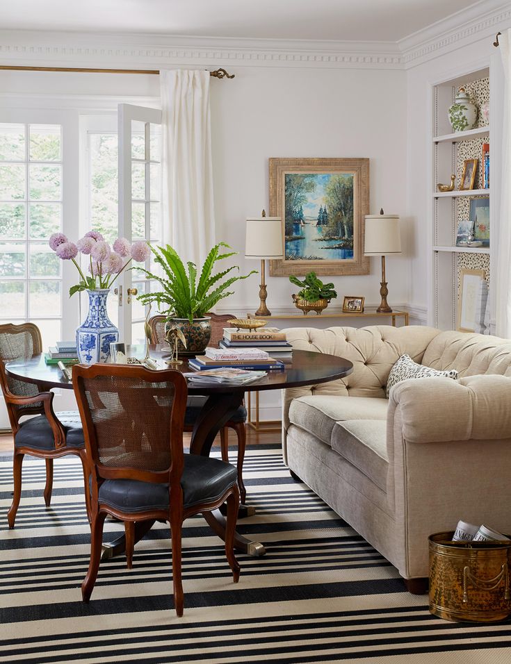 a living room filled with furniture and a table