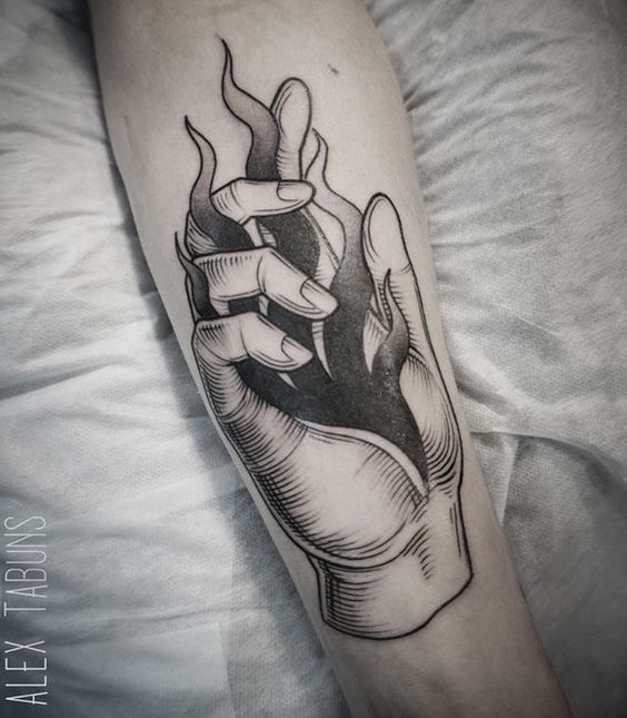 a black and white image of a hand holding something in it's palm, on the arm