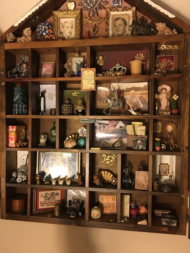 a wooden shelf filled with lots of assorted items