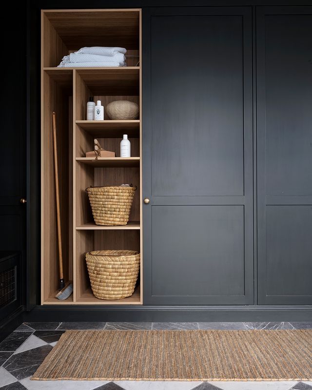 an open closet with baskets and other items