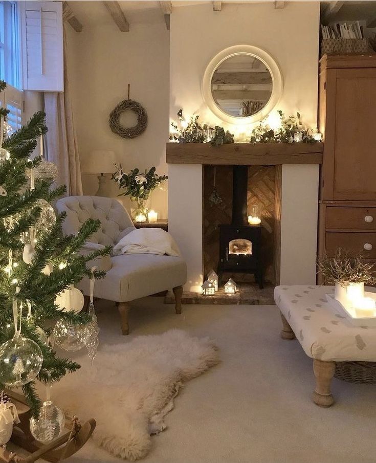 a living room filled with furniture and a christmas tree in front of a fire place