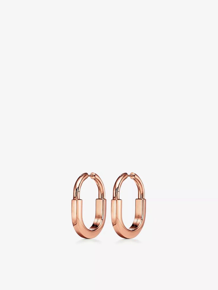 Since it was founded in 1837 and up until the 50s, Tiffany & Co. produced functional padlocks, and the latest contemporary iteration comes in the form of the gleaming Lock earrings. A far cry from robust archival designs, the pair's sleek and fluid lines symbolise inclusivity and togetherness. They're imagined in 18-carat rose gold and delicately punctuated with glistening diamonds. Tiffany Co Earrings, Tiffany And Co Earrings, Lock Earrings, Wedding Shoes Boots, Bath Dress, Far Cry, Baby Changing Bags, Bag Boys, The White Company