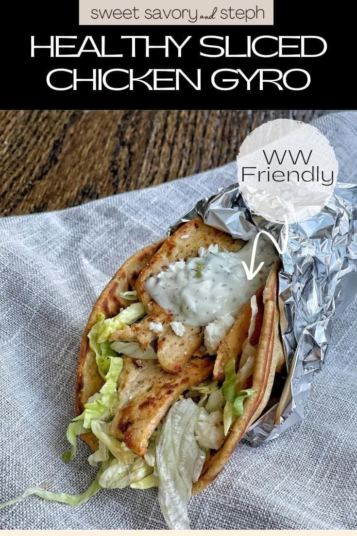 a taco filled with chicken and lettuce wrapped in foil