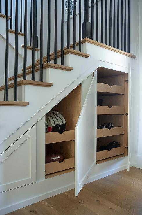 an under the stairs storage area with shoes