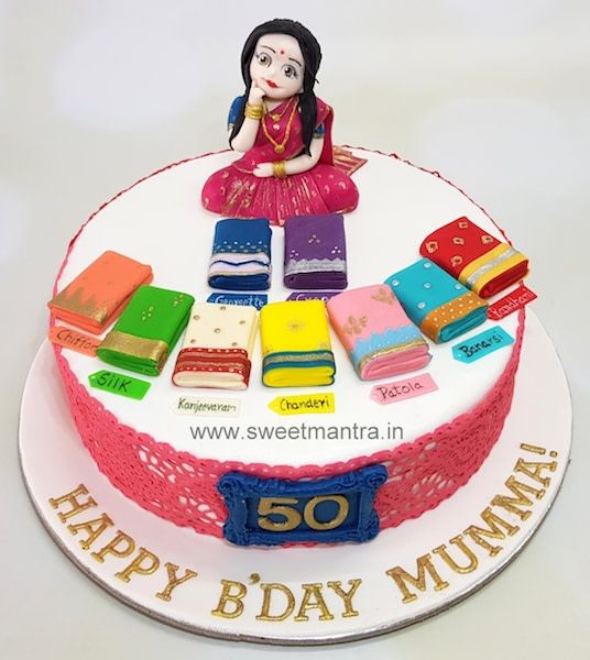 there is a birthday cake with an image of a woman sitting on top of it