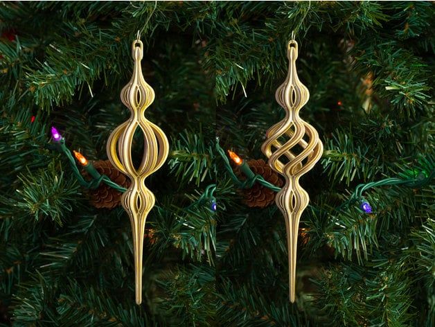 two wooden ornaments hanging from a christmas tree