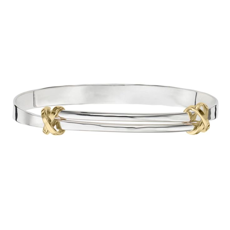 Introducing the exquisite E.L. Designs Signature Kiss Bangle Bracelet, a breathtaking fusion of sterling silver and 14kt yellow gold that will ignite your style with timeless elegance