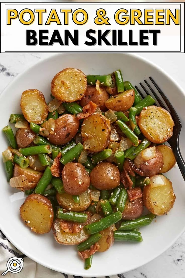 potato and green bean skillet in a white bowl with a fork on the side