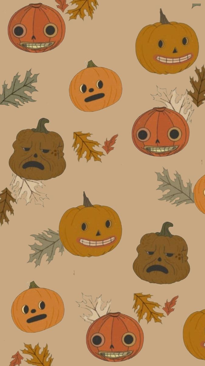 pumpkins and leaves with faces drawn on them are featured in this seamless pattern