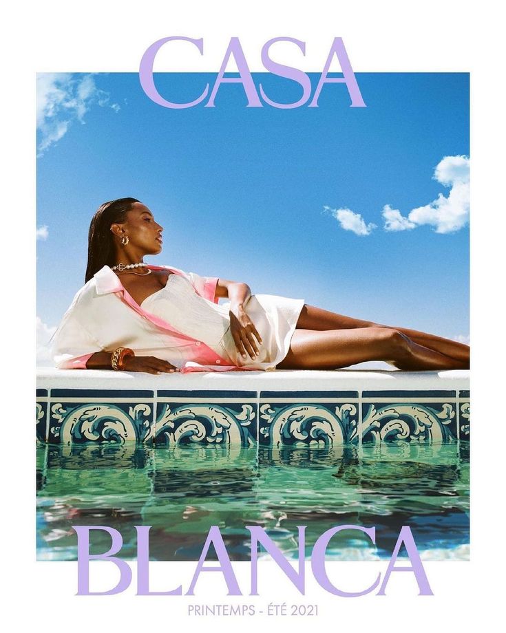 a woman laying on top of a swimming pool next to the words casa blancca