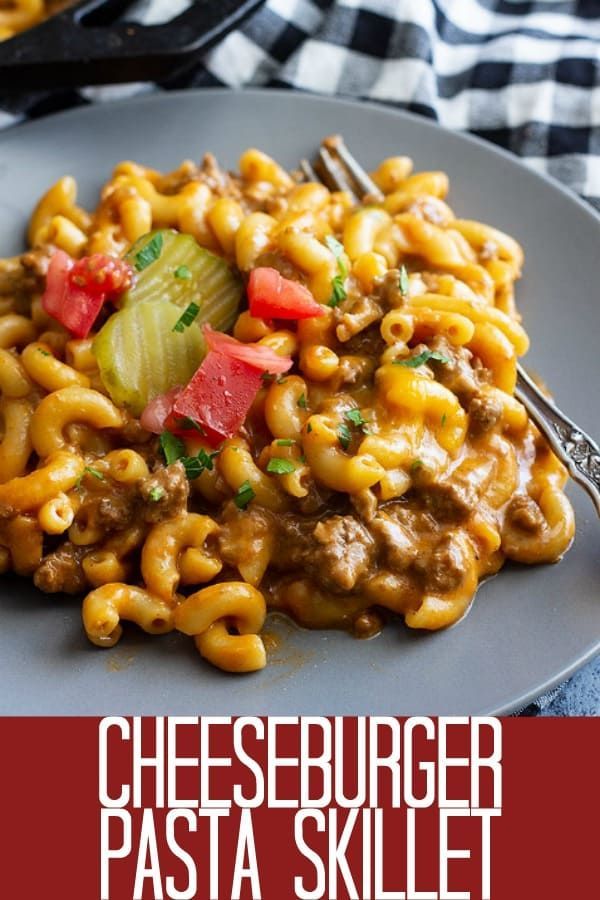 the cheeseburger pasta skillet is served on a plate with a fork in it