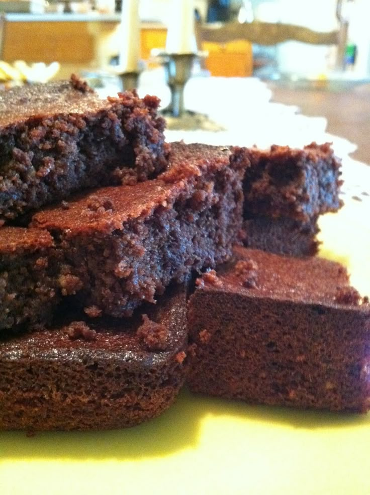 some brownies are stacked on top of each other