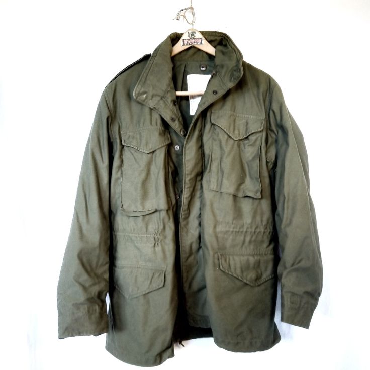 Vintage M65 Vietnam Era Army Jacket. Euc Medium Long Length 35" (Back) Shoulders 21" Sleeve 27" P2p 25" Winter Military Cargo Style Utility Jacket, Military Cargo Style Utility Jacket For Winter, Military Style Parka With Cargo Pockets For Spring, Spring Military Parka With Cargo Pockets, Military Style Parka For Cold Weather In Fall, Combat Style Khaki Parka For Fall, Green Combat Outerwear For Fall, Military Style Outerwear With Flap Pockets, Long Sleeve Military Parka With Pockets