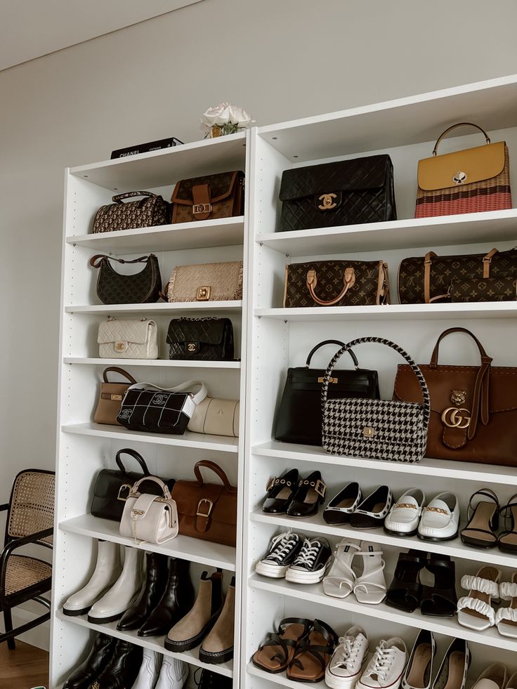 a white shelf filled with lots of purses and handbags on top of it