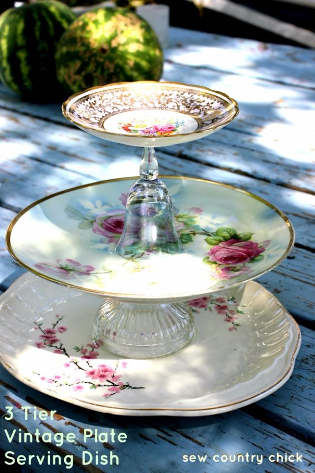 three tiered plate serving dish sitting on top of a wooden table