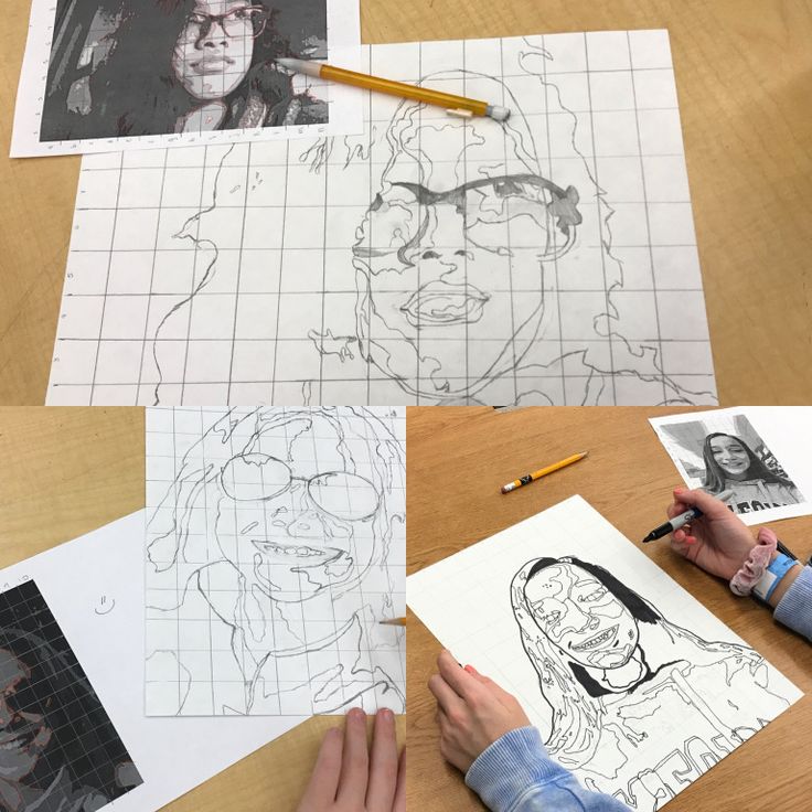 someone is drawing faces on paper with pencils