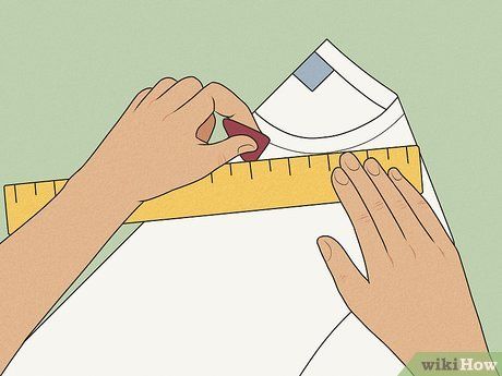 someone is cutting paper with a tape and scissors on top of the measuring ruler that they are holding