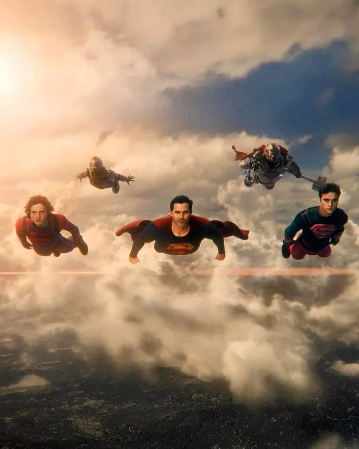 several people are flying through the air in superman movie costumes, with clouds and sun behind them