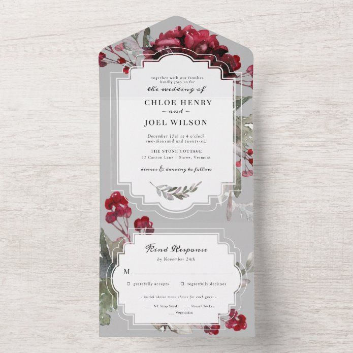 a wedding card with red flowers on it